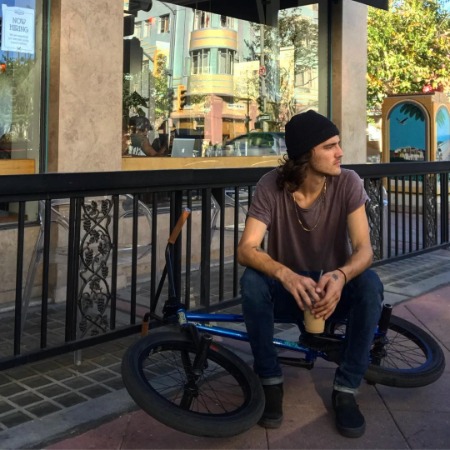 Connor Keating chilling with his BMX